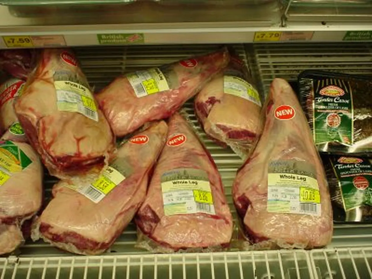 Packaged leg of lamb in a supermarket meat case